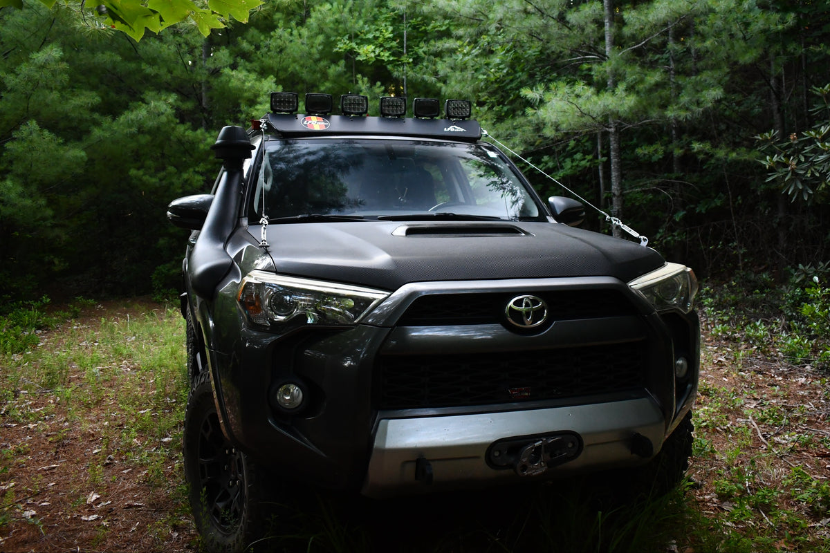 4Runner showing Limb Riser Kit in the woods
