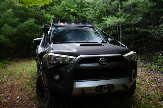4Runner showing Limb Riser Kit in the woods